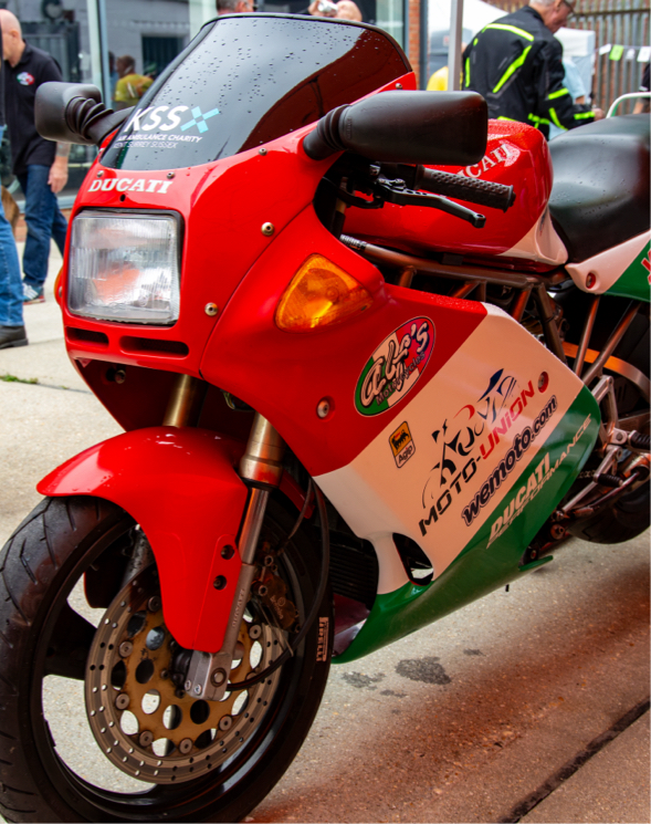 Red Ducati motorbike branded Moto-Union and their supporting partners.
